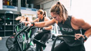 Due to its technical difficulty, rugby players and fans worldwide adore this wonderful sport. However, there is no doubting the necessity of being physically ready for every game. And the best approach to staying in rugby condition is to discover the most effective exercise that pushes you without putting you in danger of injury. As such, rugby players frequently look for devices that may help them work out several sections of their body at the same time because the sport utilises all of your major muscle groups, and assault air bikes come into play here. Although this equipment isn’t new, they’re making a big comeback because of the intensive training that athletes (or anybody) can do on them. What Exactly Are Assault Bikes? You’ve probably previously seen an assault bike at your gym. They resemble stationary cycles, except they have a large fan rather than a front wheel, but don’t be deceived by the exterior. When you first check out the assault bike, you’ll notice that you must pedal the bike while also pushing and tugging on the handles. This enables you to exercise your full body with a single machine while consuming 80 kcal each minute. And here’s what most sportspeople consider the machine’s best feature: the tougher it gets, the harder you go! The Advantages of Assault Bike Exercises Assault bikes are simple machines that may be used for anything from light exercises to a very hardcore workout. Meanwhile, everything depends on who is sitting on it. So here are some advantages to riding an assault bike in your exercise regimen. Enhances aerobic conditioning: Aerobic workouts boost stamina. And while exercising, the continual, cyclic motion stimulates your lungs and heart, supplying more oxygen to the muscles. It gives you a full-body workout: The pushing, pulling and pedalling motions engage virtually all of your body’s big muscle groups. And, unlike most other gym machines, assault air bikes are low-impact, so you may use them with confidence while avoiding hip, ankle and knee problems. It quickly burns calories: As previously stated, assault bikes can consume up to 80 calories a minute. So remember that the degree to which you exercise will greatly impact this. As such, athletes utilising this equipment for the first time must strive to find the proper tempo, or they will quickly become out of breath! It assesses your mental fortitude: Many sportspeople have the physical ability but don’t have the mental fortitude to excel. As such, assault bike exercises are meant to push you while reducing injury risk, which aids in the development of mental stamina on game day. Excellent for player rehabilitation: Injuries can have both psychological and physical consequences. As such, exercising on assault bikes will help you gain the mental fortitude you need to get back to playing and reduce your chances of re-injury. Maintains the temperature of your workout space: While it may appear comical, the large fan that offers resistance creates a wonderful draught, leaving your exercise area cooler than normal. Assault bikes are wonderful low-impact equipment for losing weight, toning up, and increasing mobility, as much as they are inexpensive, long-lasting, and scalable. Furthermore, there are numerous appealing routines necessary to keep you engaged. On the other hand, air bikes are not ideal for muscle training or enhancing bone density. Remember that overtraining on fan bikes is quite tempting, so schedule your routines carefully to accomplish your fitness goals. It's also useful to understand that not all assault air bikes are made equal. Some are better for toning, while other bikes are better for HIIT and flexibility. So, choose intelligently, considering all of your needs and pre-existing health conditions!